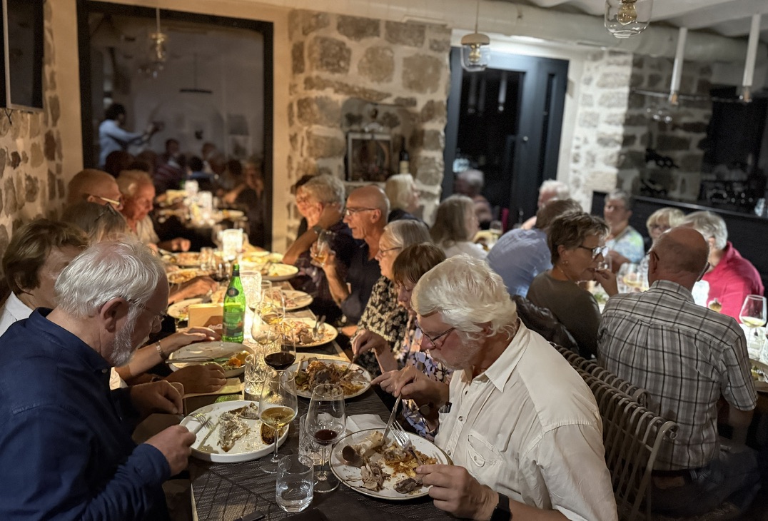 Ombra indoor stone-walled dining room with a long table, Kotor