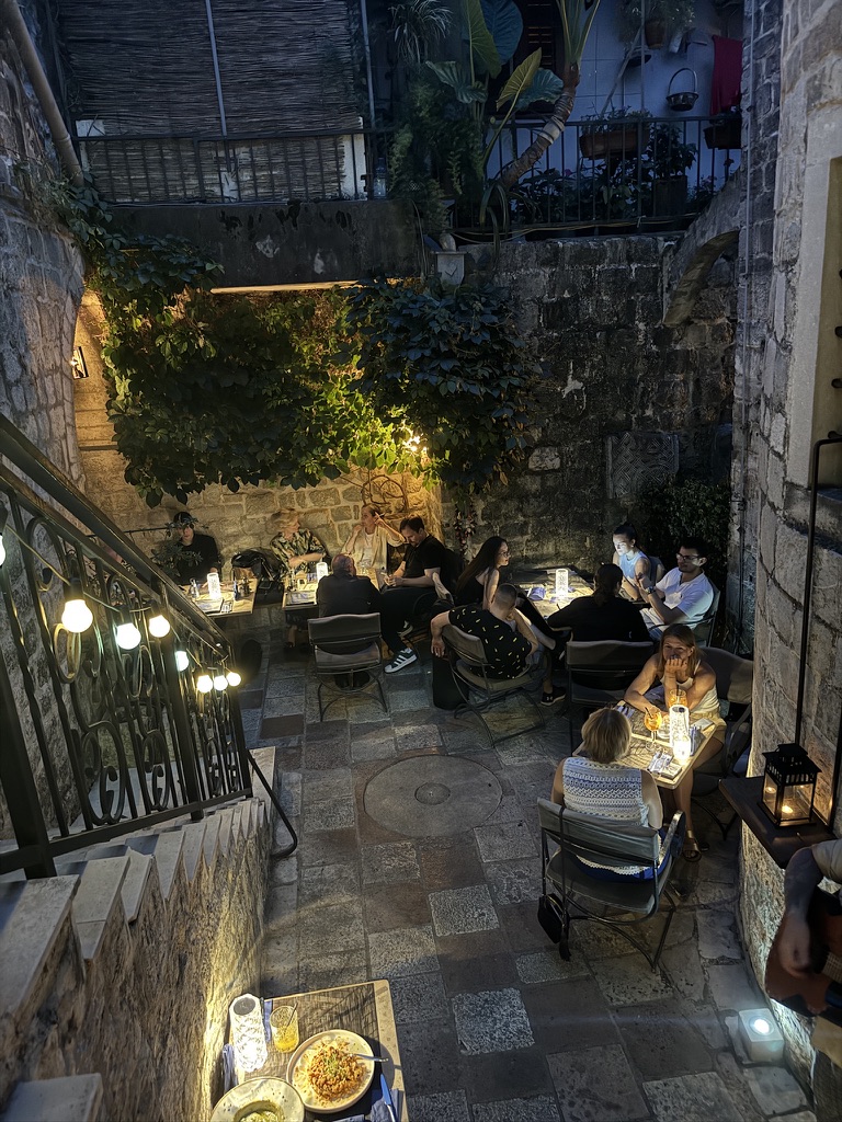 Ombra secret garden courtyard with lantern-lit tables, Kotor Old Town