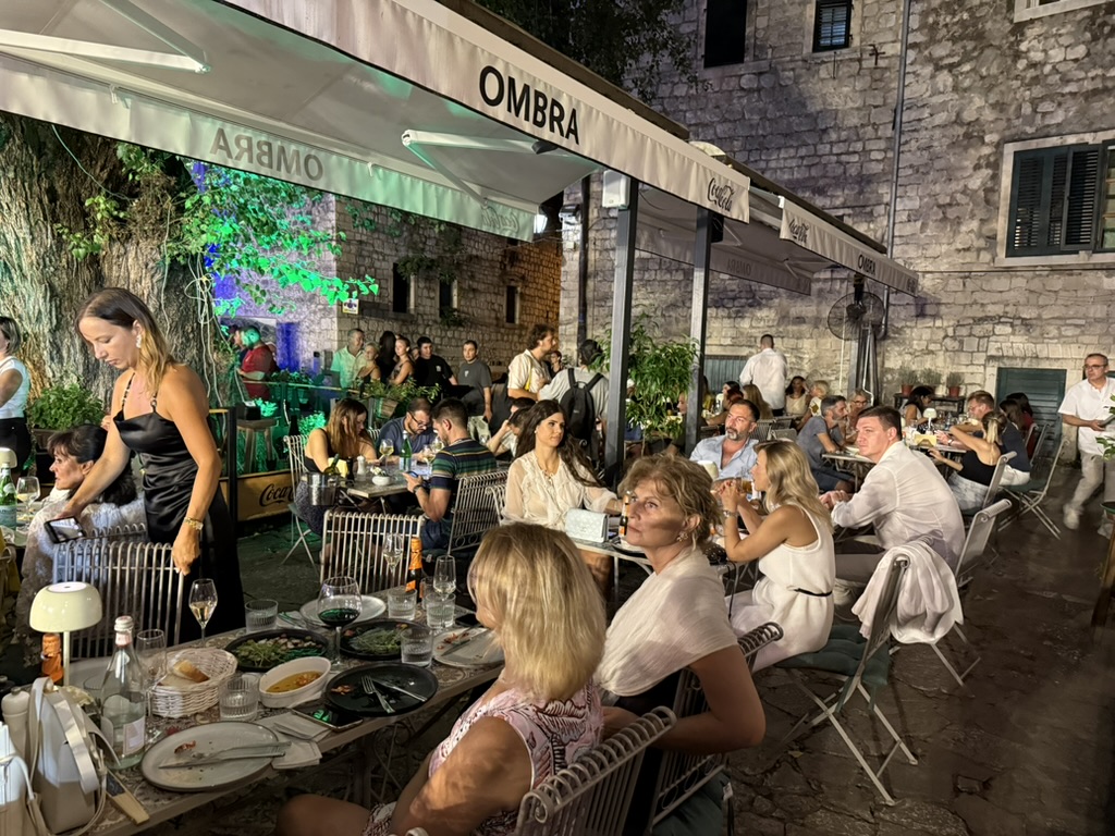 Ombra terrace under the OMBRA awning, busy summer evening in Kotor Stari Grad